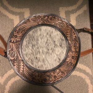Cowhide and tooled leather canteen purse